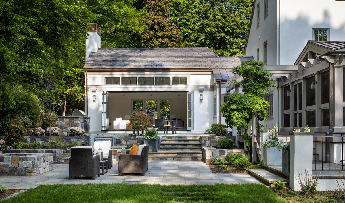outdoor view of house with stone patio© Jacob Lilley Architects Wellesley, MA